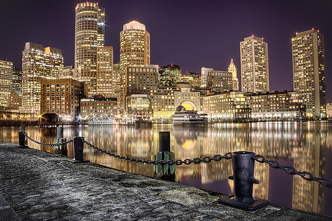 The Boston skyline lit up late at night.